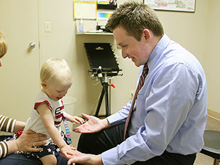 Dr Zach Hubner with chiropractic patient